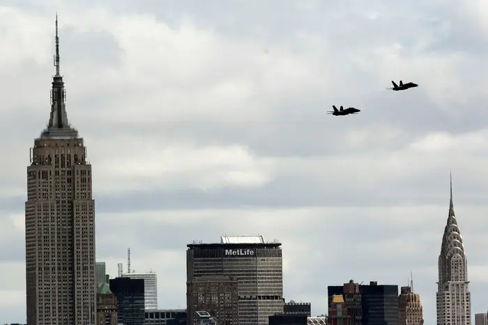 Two US Navy Flight Demonstration Squadron jets, better known as Blue Angels, seen from Liberty State Park in Jersey City, N.J., execute a survey flight over New York City, including the Empire State Building, left, and the Chrysler Building, right